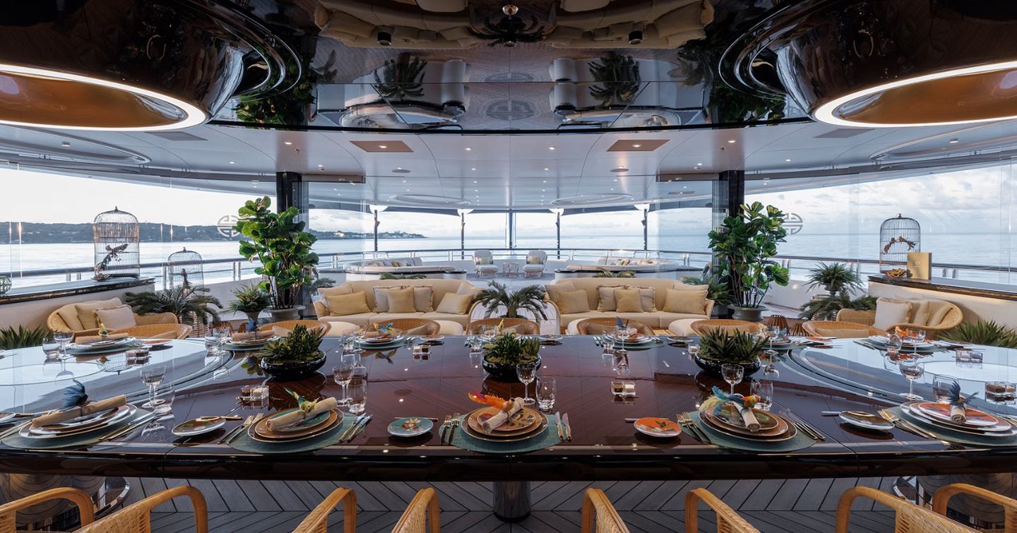 Superyacht Ahpo aft winter garden area with shaded alfresco dining
