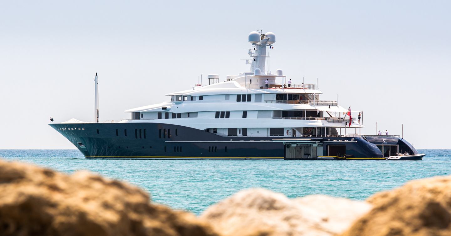 Superyacht HBC showing its port-side while anchored at sea