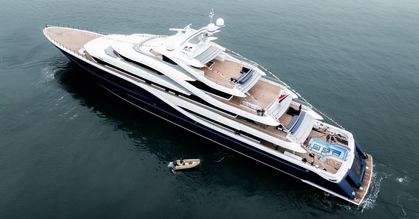 Turquoise superyacht Angelique at anchor aerial view 
