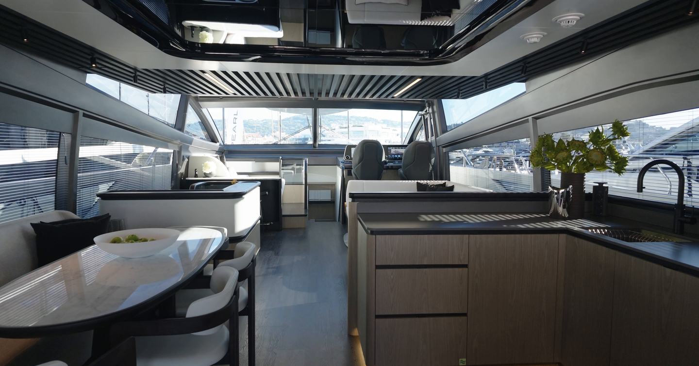 Pearl 73 main deck interior with dining area, aft galley and lower helm