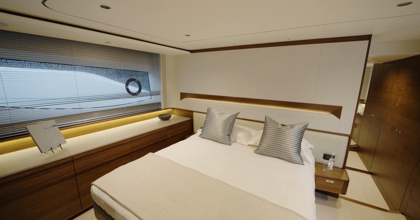 Princess S65 Mk2 full-beam owner's cabin with double bed, hull window and walnut cabinetry