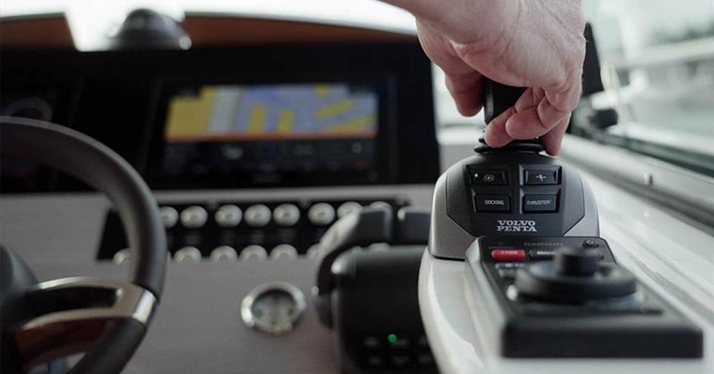 Man operating Volvo Penta joystick control system 