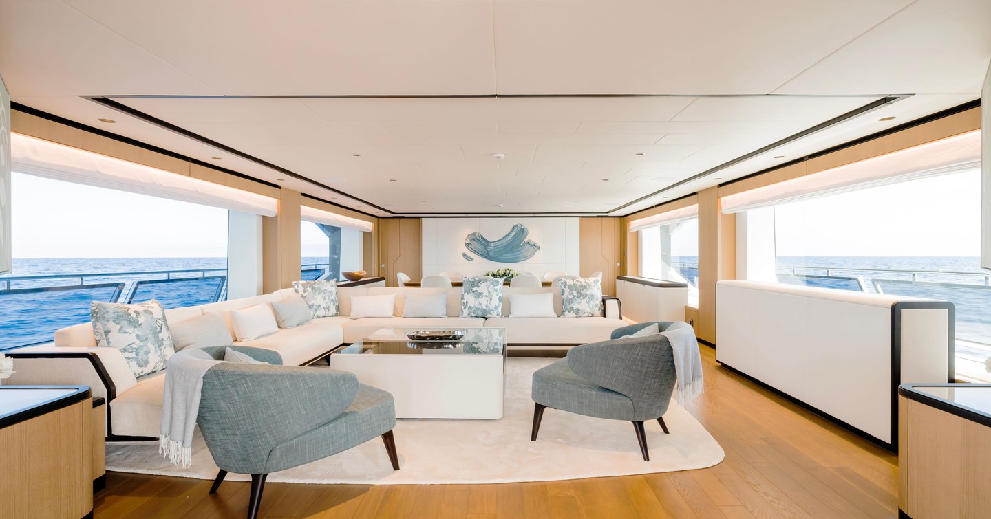 Superyacht Olivia main saloon with white L-shaped sofa 