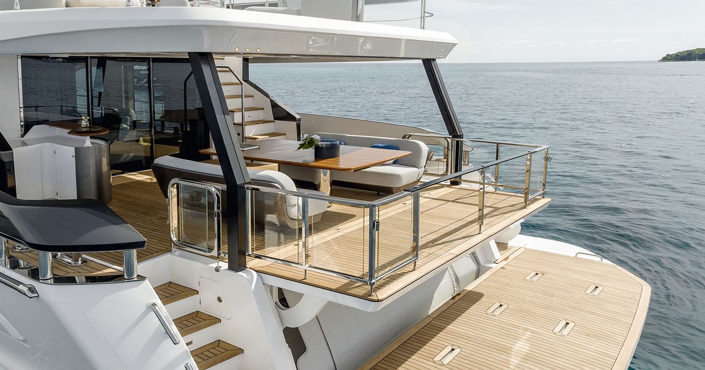 Overview of aft area onboard Azimut Grande 26 Metri. Swim platform and extended balcony with views of the sea.