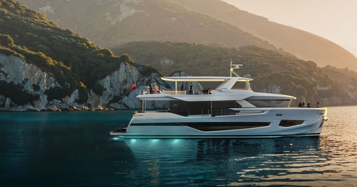 Motor yacht 27XP at anchor with sunsetting and hull lights