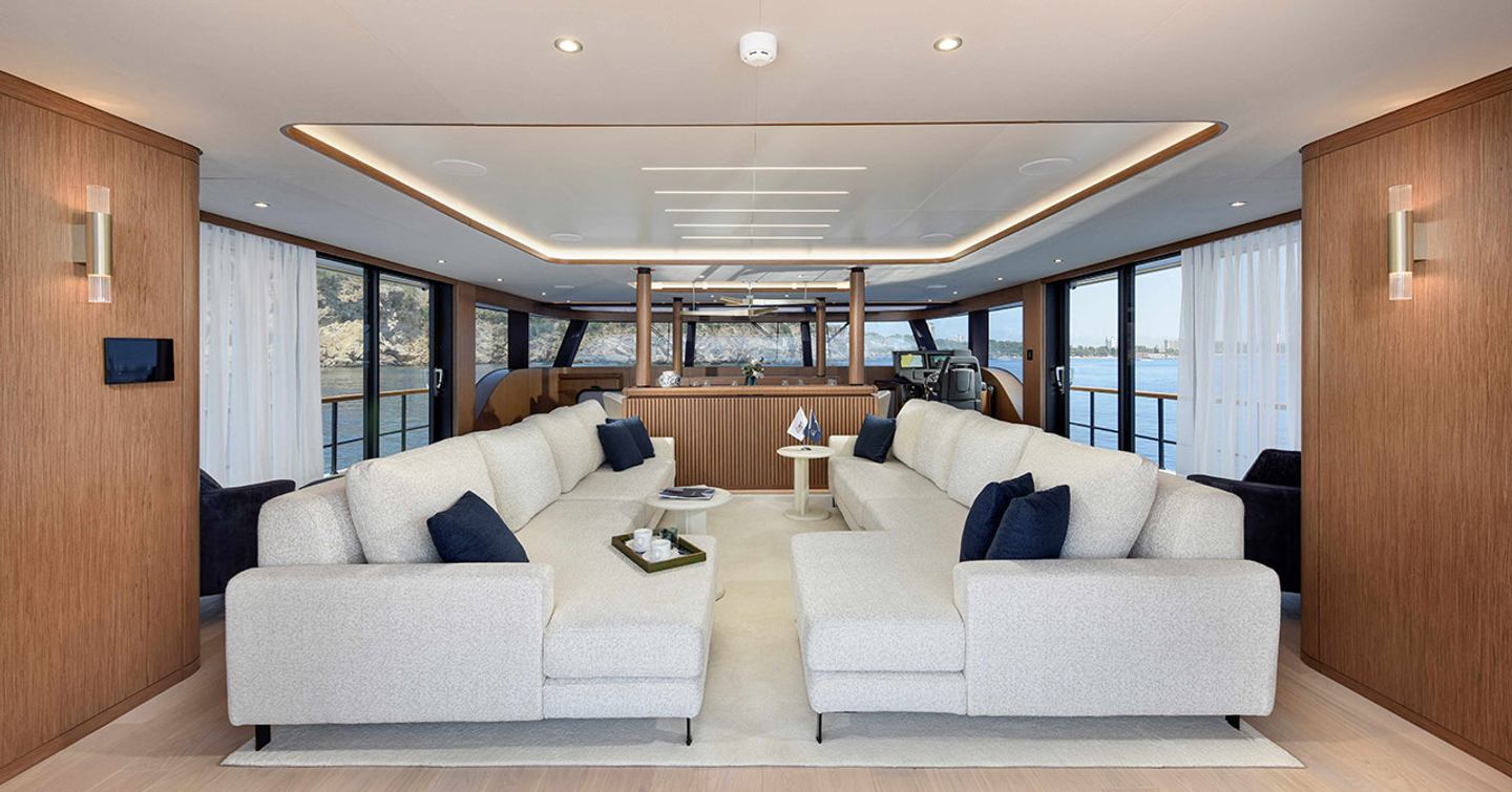 Lazzara LPC 300 Catamaran main saloon with dual L-shaped sofas