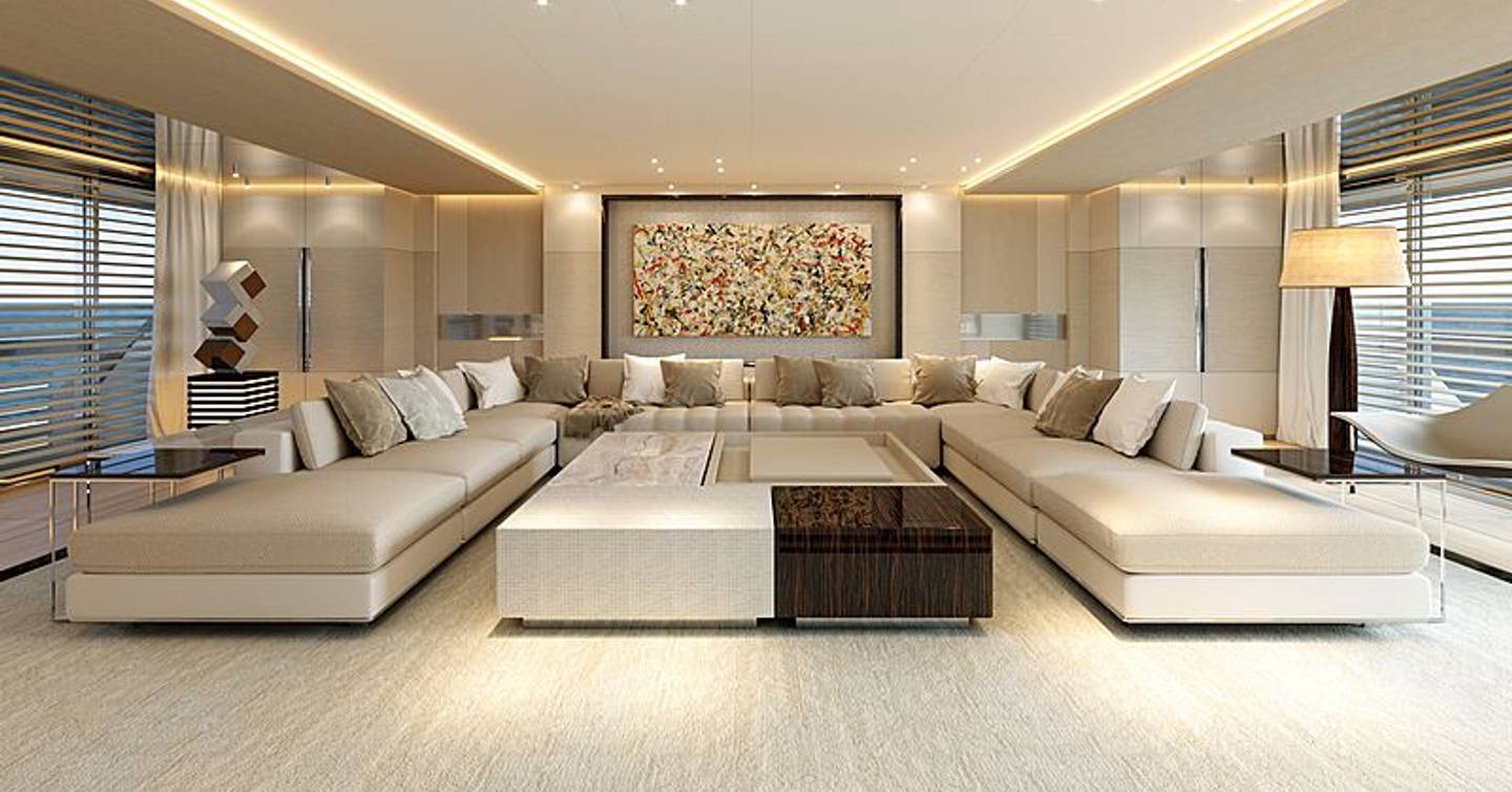 large U-shaped cream sofa wraps round a rectangle shaped coffee table in main salon with white furnishings on board Sanlorenzo 64 Steel yacht