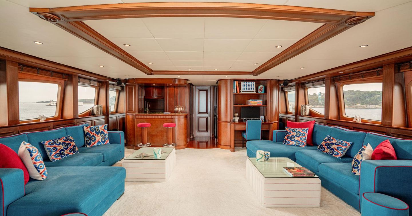 Superyacht Bang! skylounge with dual blue sofas and bar area 