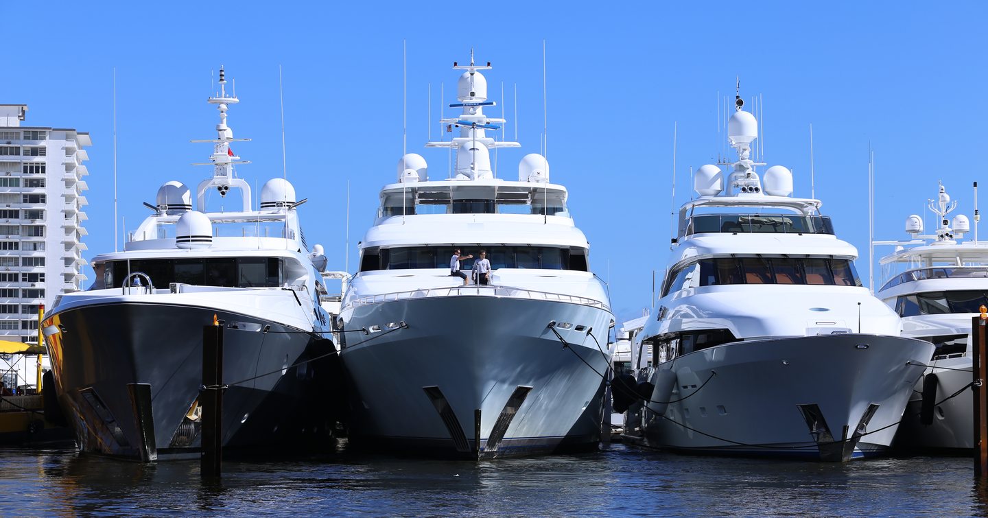 Superyachts at anchor at FLIBS with Fort Lauderdale in background 