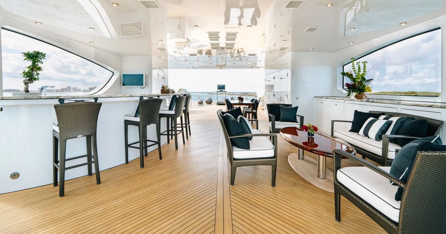 Superyacht Elis Et Mar sundeck with shaded seating and integrated bar area 