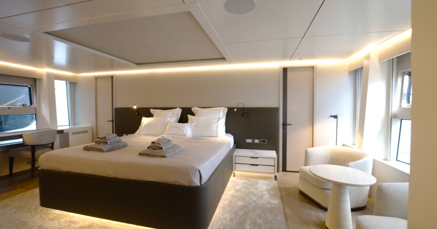 Numarine 40MXP main deck VIP cabin with king-size bed, seating area and panoramic windows