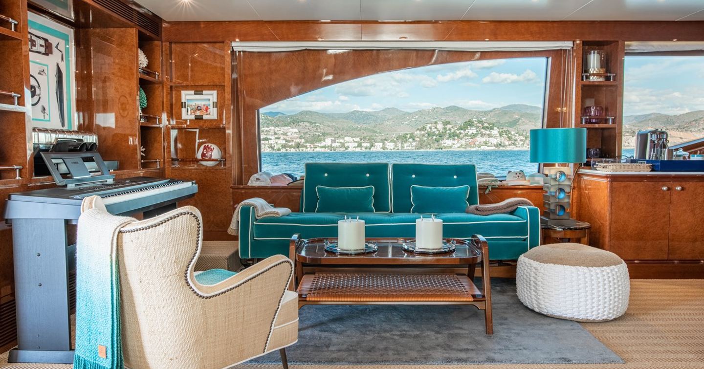 Superyacht Checkmate skylounge with blue furniture and keyboard