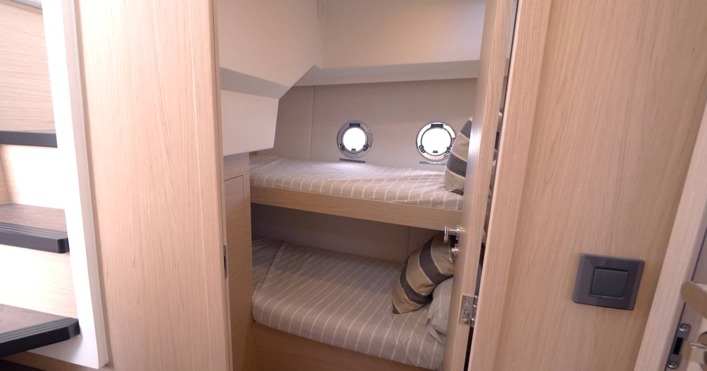 Guest cabin with twin bunk beds in the Beneteau Swift Trawler 37 Fly