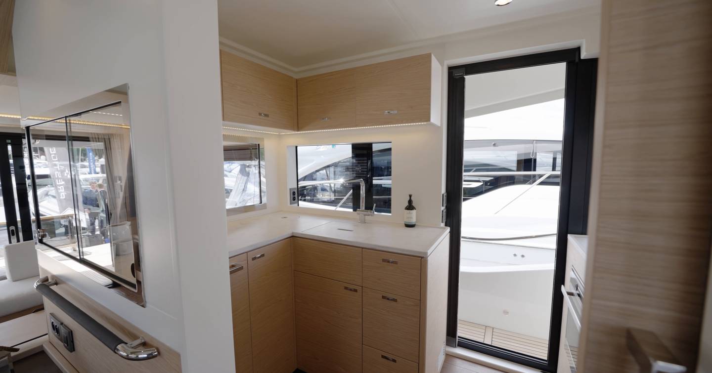 Beneteau Grand Trawler 63 U-shaped galley with side deck access and generous storage