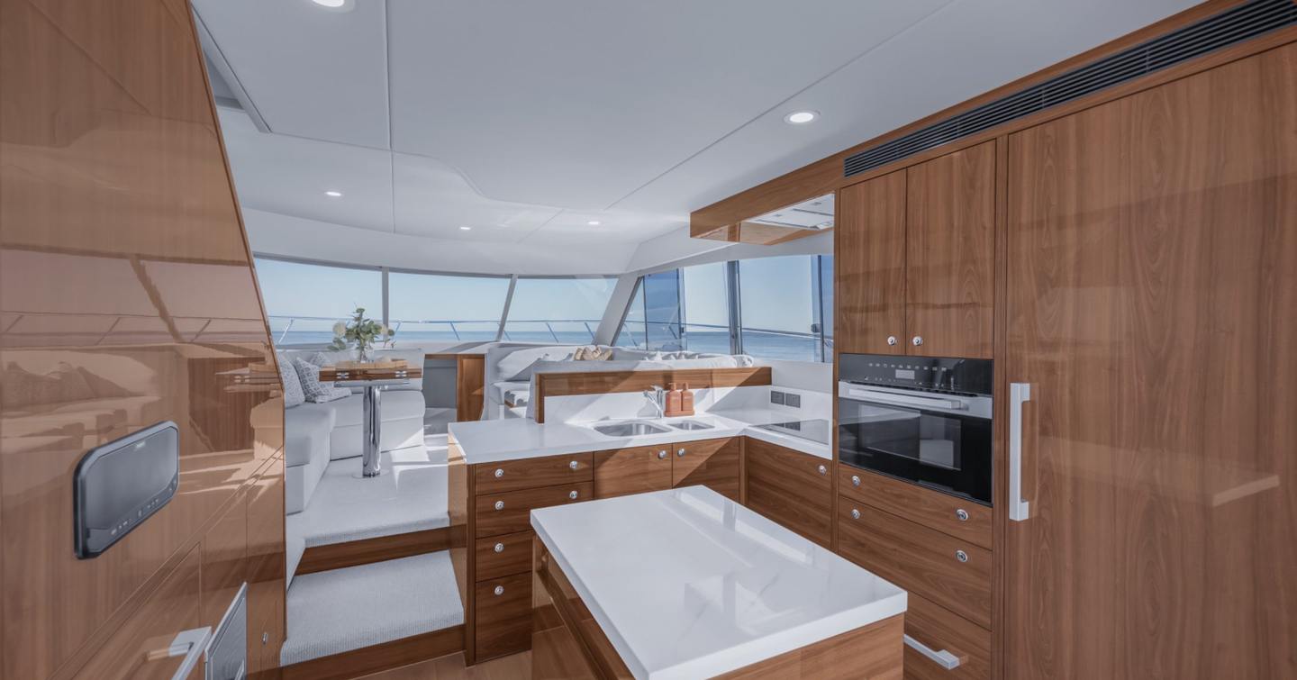 Maritimo M50 galley with central island, oven, and raised saloon seating forward