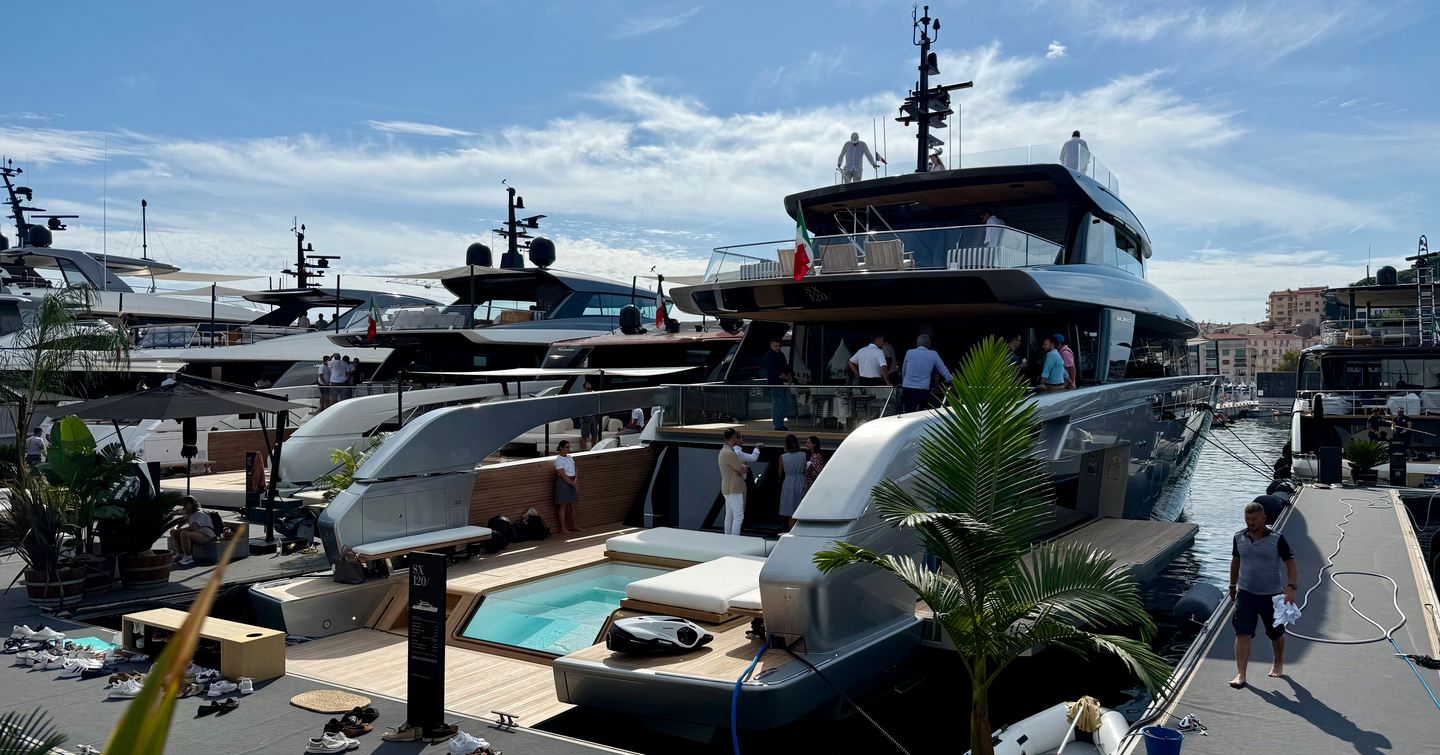 Workers on superyacht with infinity pool docked at 2025 Cannes Yachting Festival