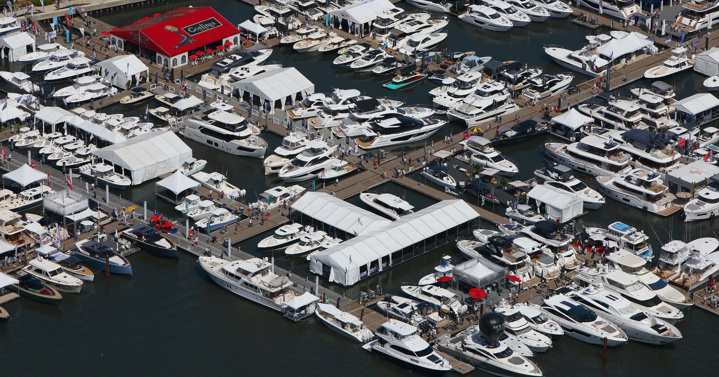 Overview of Palm Beach International Boat Show from above, hundreds of yachts berthed with exhibitors along pontoons.