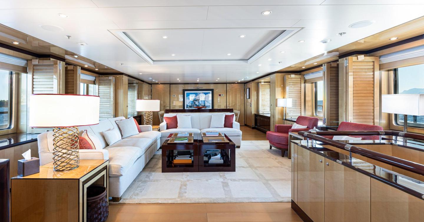 Superyacht Were Dreams main saloon with L-shaped cream furniture 