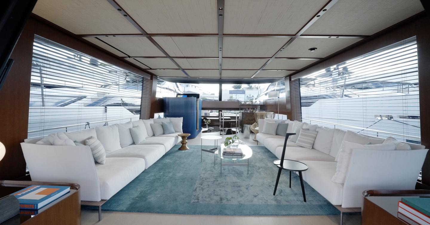 Main saloon of the Sanlorenzo SHE with low sofas and large side windows