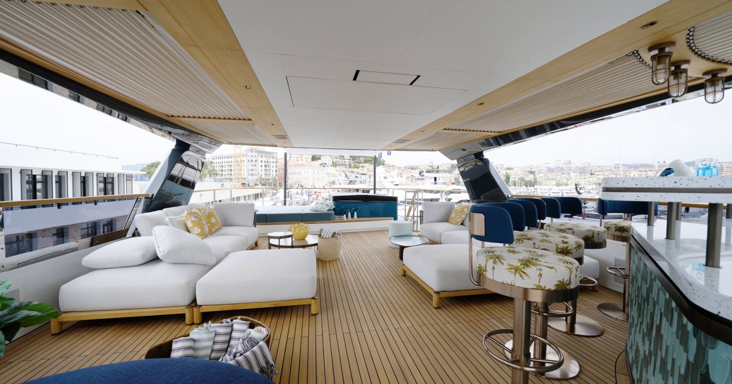 Sirena 118 sundeck with lounge seating, aft jacuzzi and bar stools