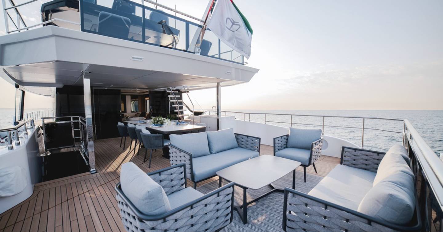 Majesty 112 Terrace Motor Yacht aft deck with shaded alfresco dining 