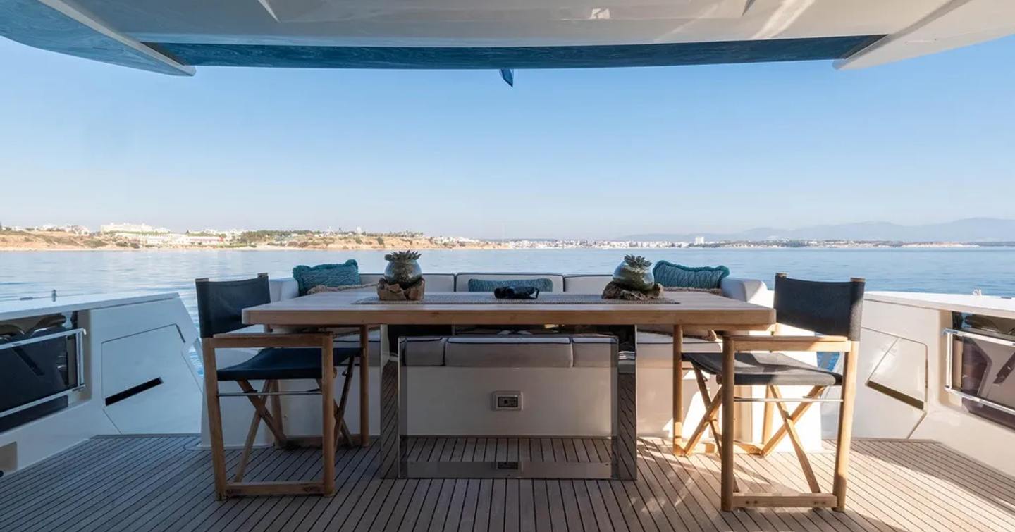 Motor yacht Dogu's shaded dining aft table 