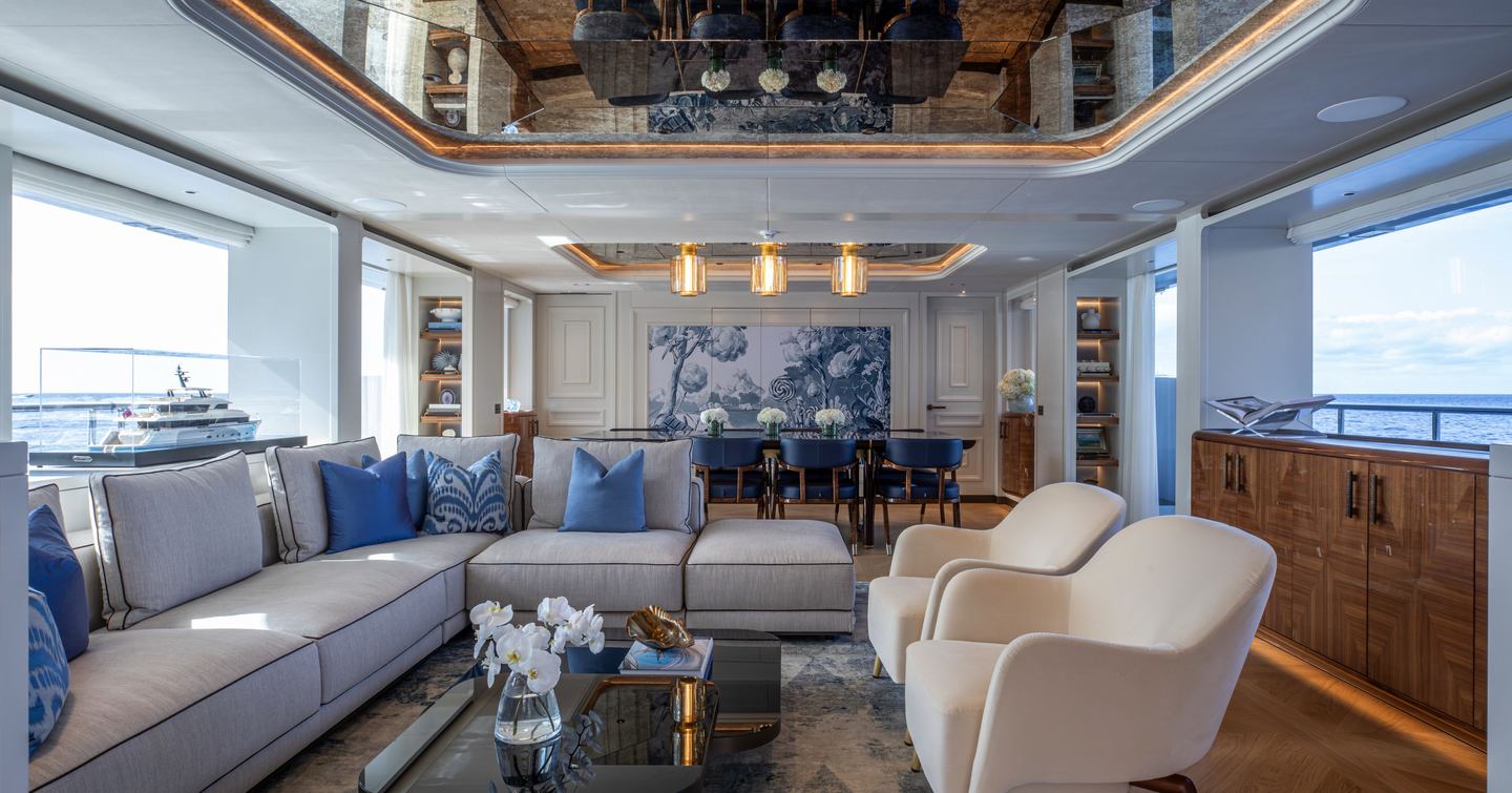 Moonen 122 Martinique Superyacht Lollipop main salon with L-shaped white sofa and marbled rug