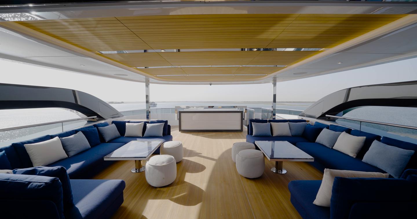 Sundeck aboard the Gulf Craft Majesty 145 with twin lounge areas, full bar and hardtop