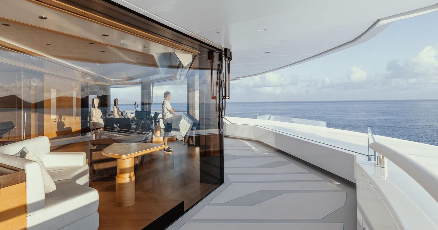 Superyacht Leviathan walk around with glass walls and teak finishes