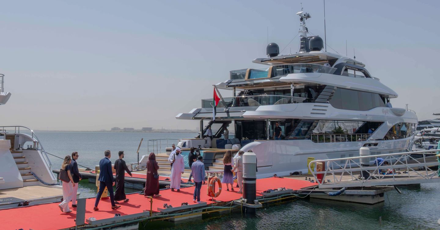 People walking onto Gulf Craft Majesty 145 Superyacht Suzie Q at open yacht event
