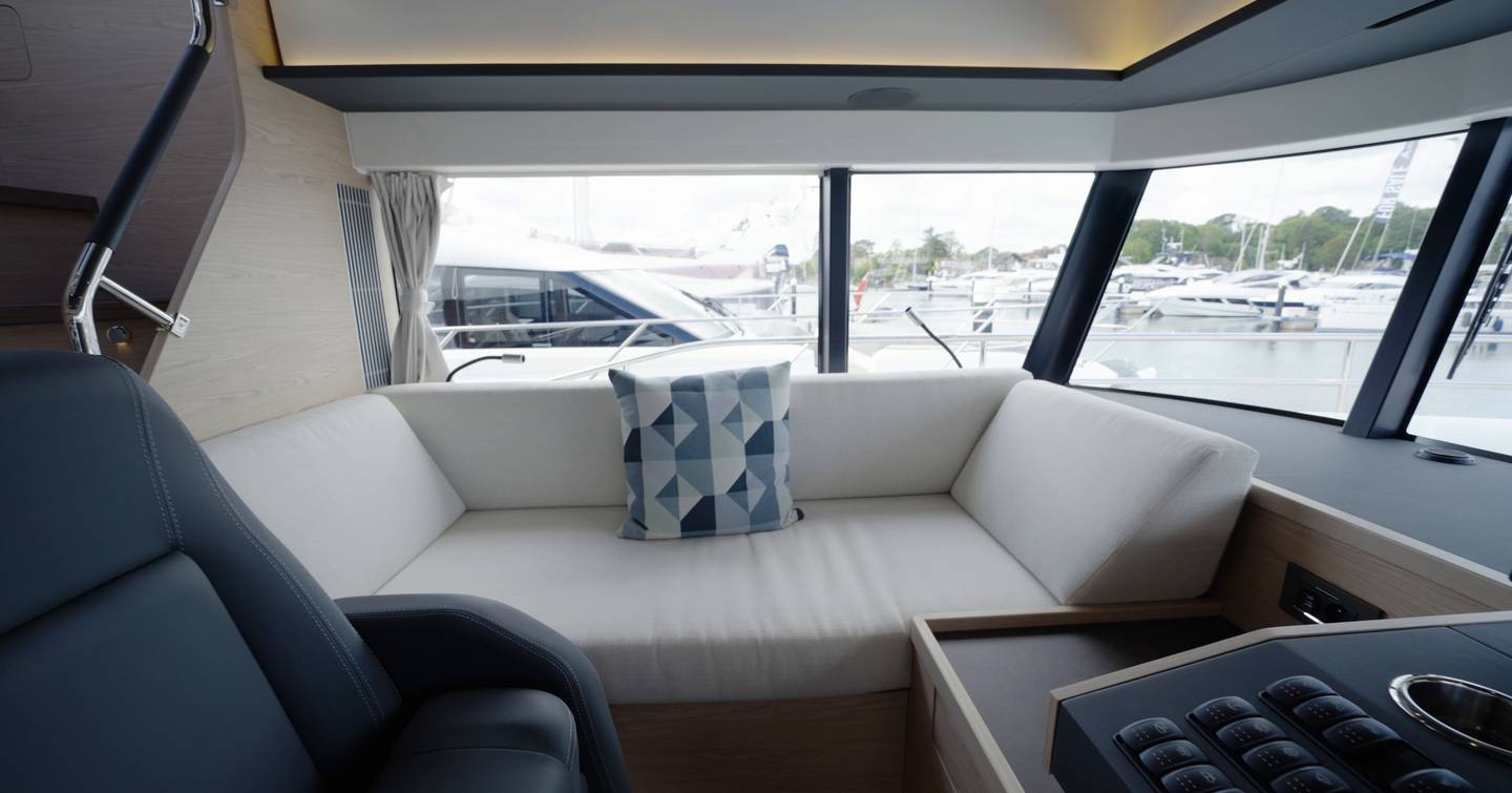 Beneteau Grand Trawler 63 lower helm companion seat with panoramic forward views for passage making