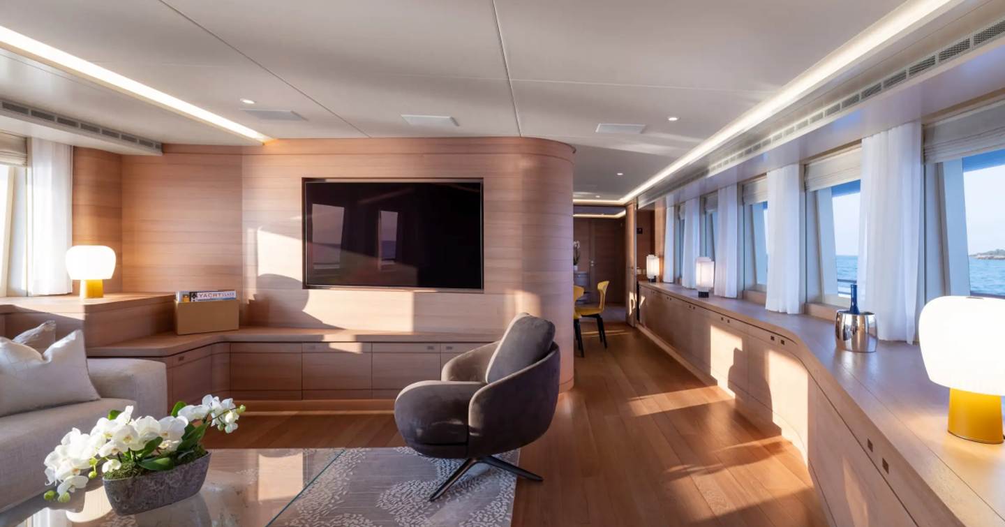 Expedition yacht Bijin main saloon seating area with mounted TV