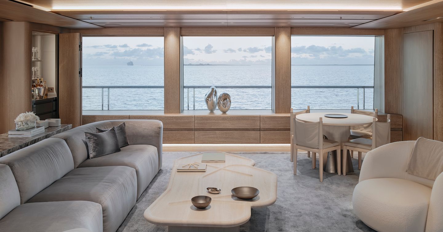 Rendering of Superyacht Entourage skylounge with grey L-shaped sofa 