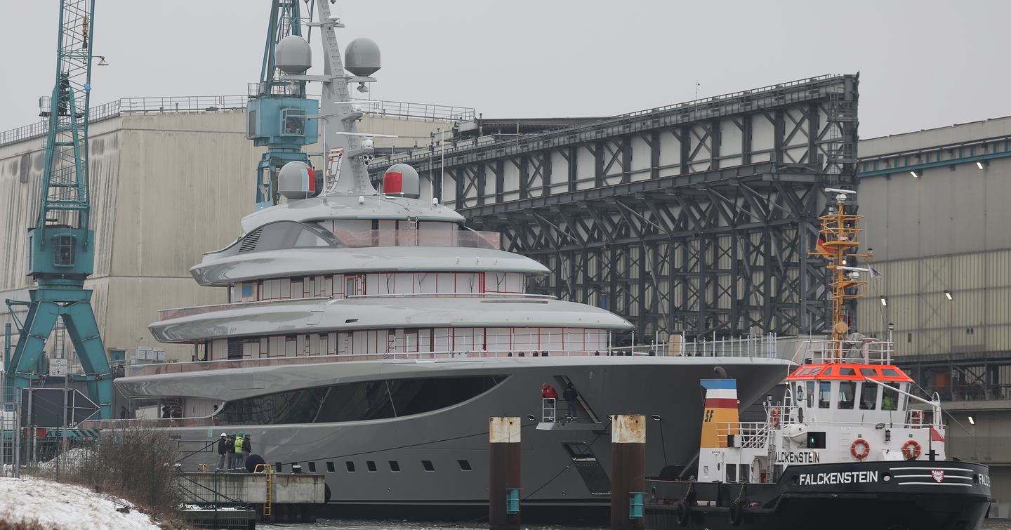 Superyacht Nixie behind tugboat at launch