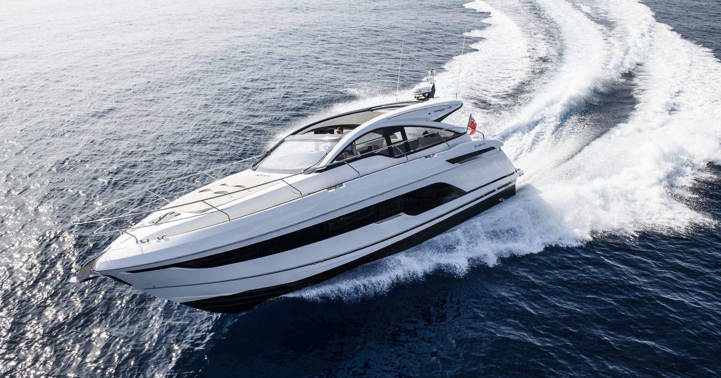 Targa 45 with white exterior and black glazing cuts through the water 