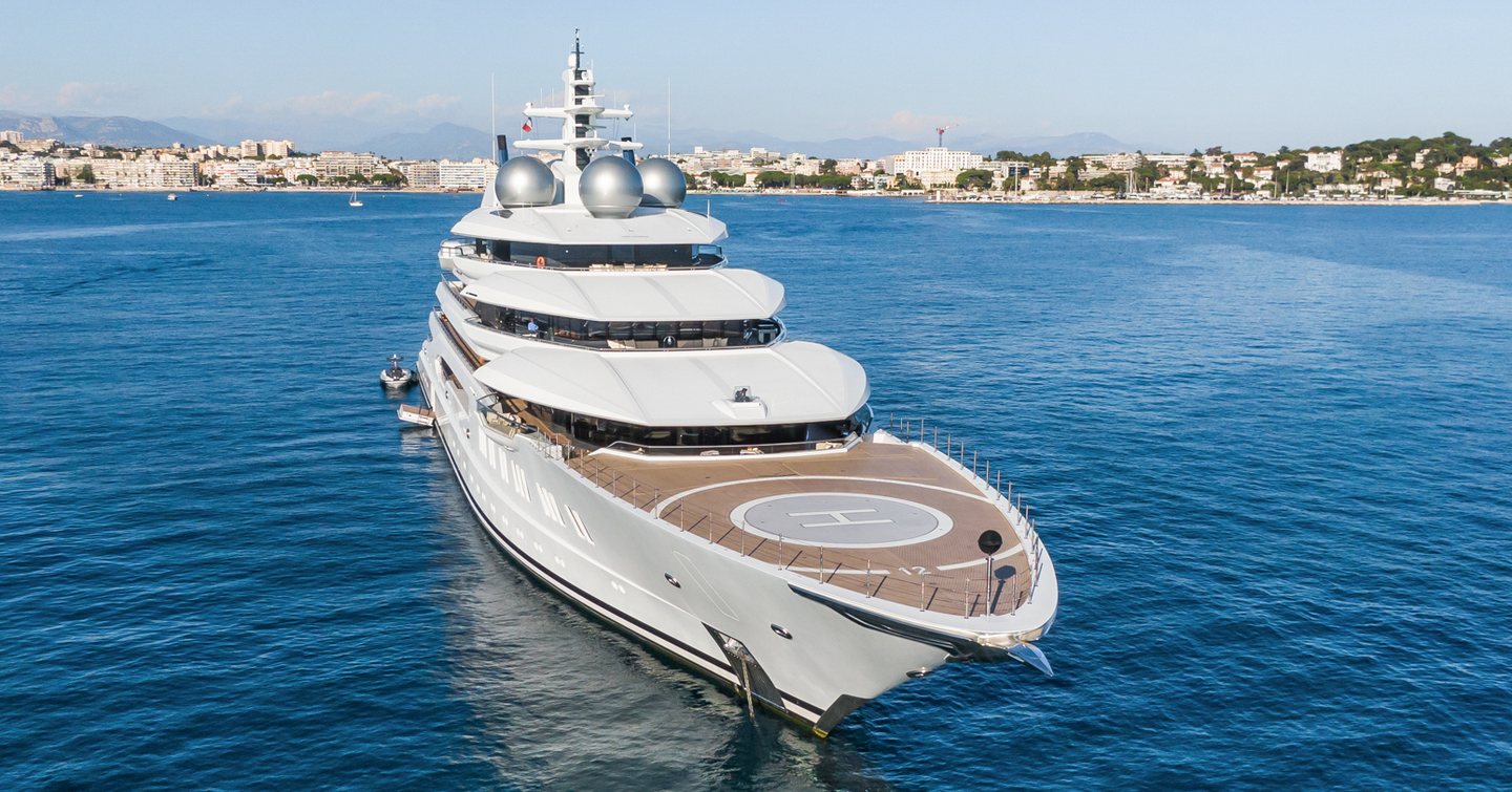 Close up of Superyacht Amadea bow and helipad at anchor