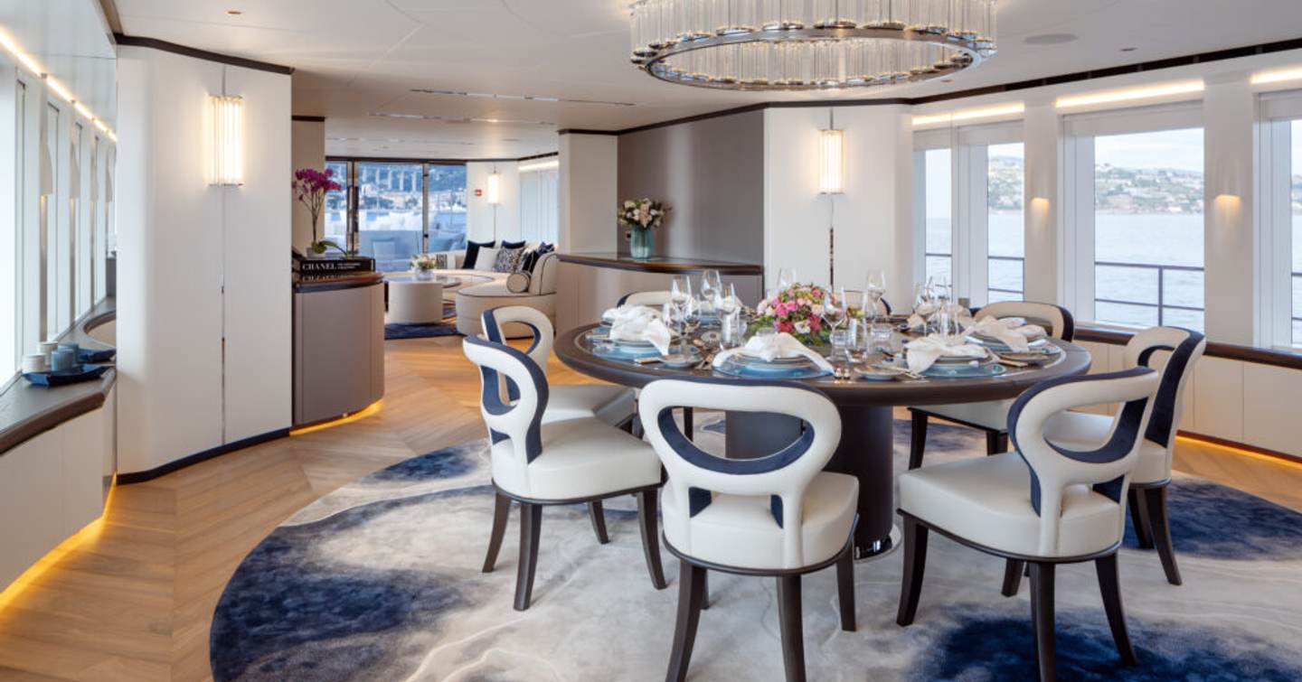 Motor yacht ALP dining room with circular table and chandelier 