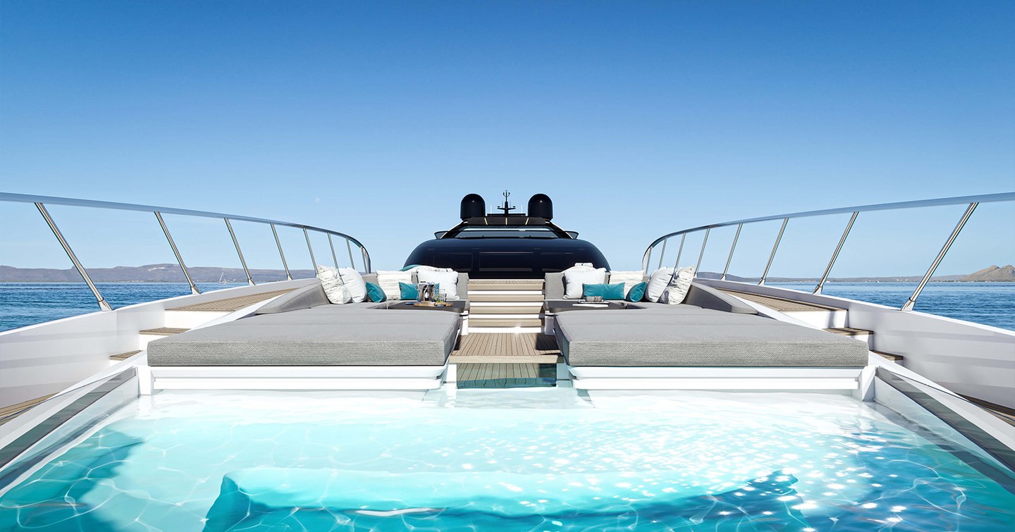 Overview of Mangusta 165 REV foredeck, infinity pool in foreground with sun pads and bridge aft.