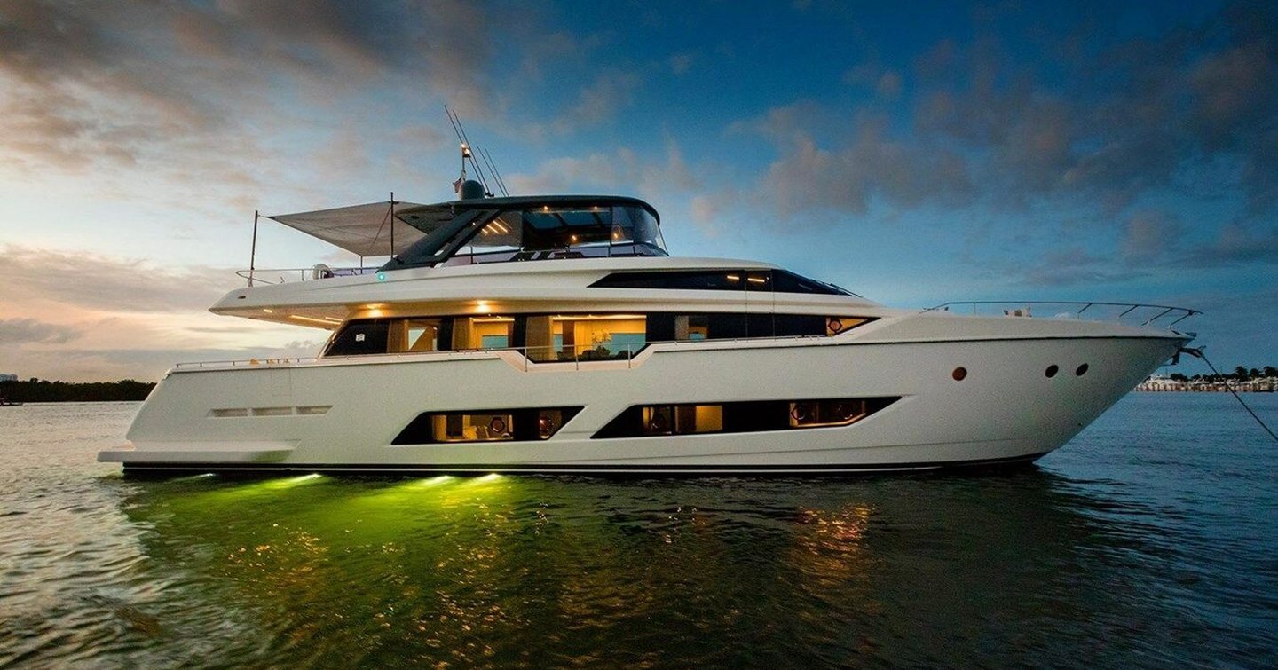 Motor yacht Alter Ego at anchor with underwater lights