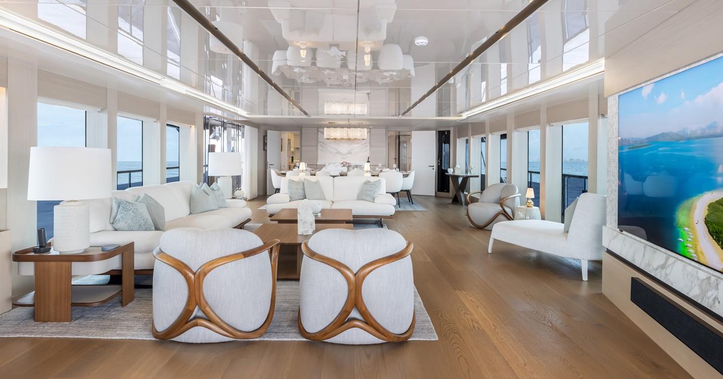 Superyacht Evelyn P's main saloon with stools and white furniture