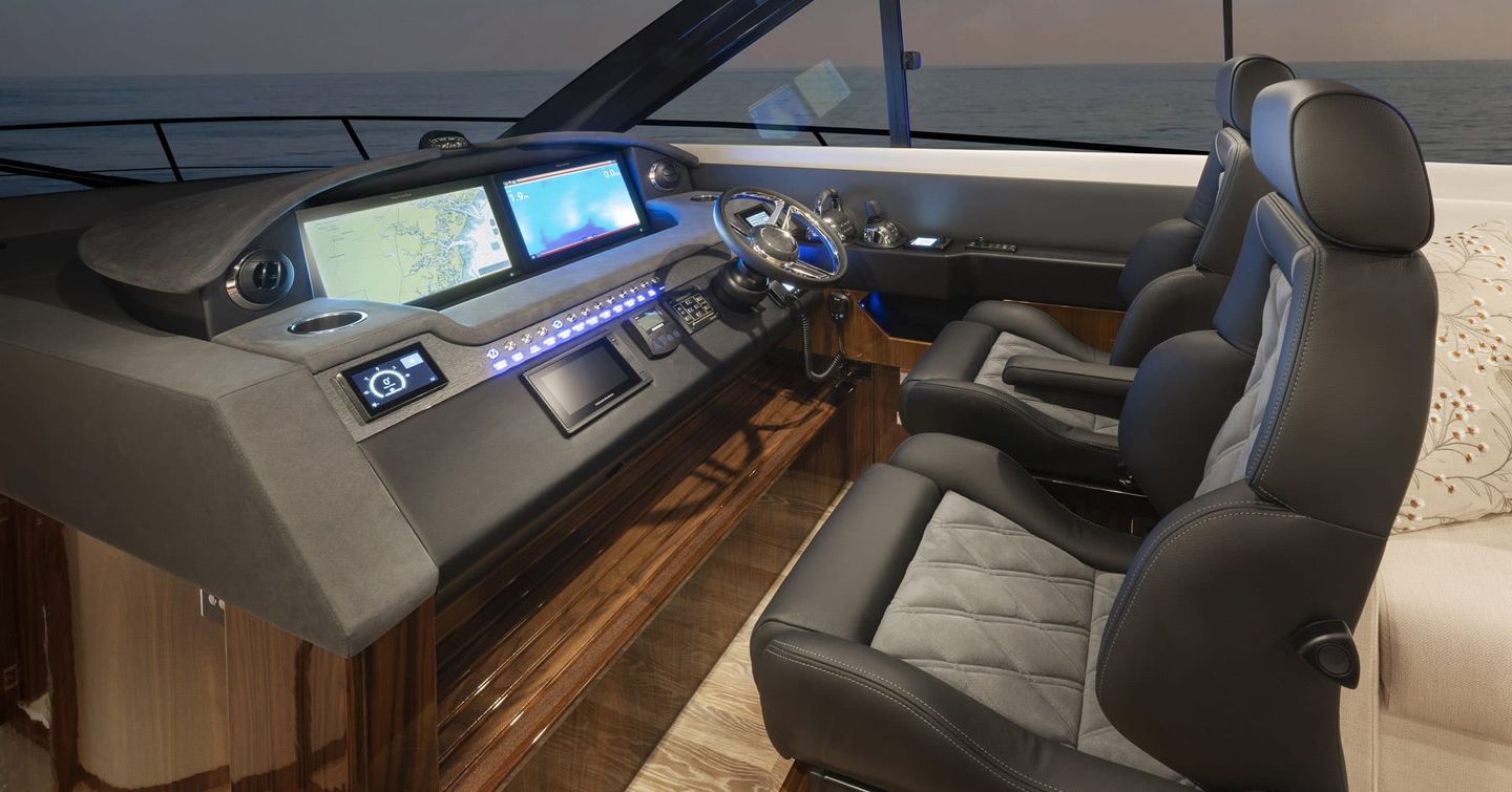 Riviera-6000-Sport-Yacht-Platinum-Edition-Review-helm-console-with-dual-seats-and-navigation-displays