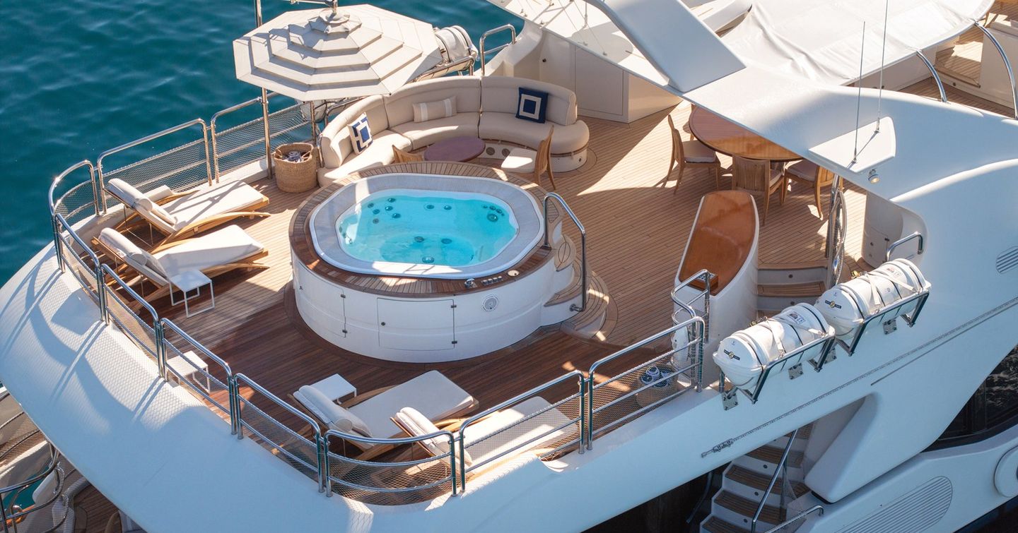 Superyacht Checkmate upper deck jacuzzi and curved seating
