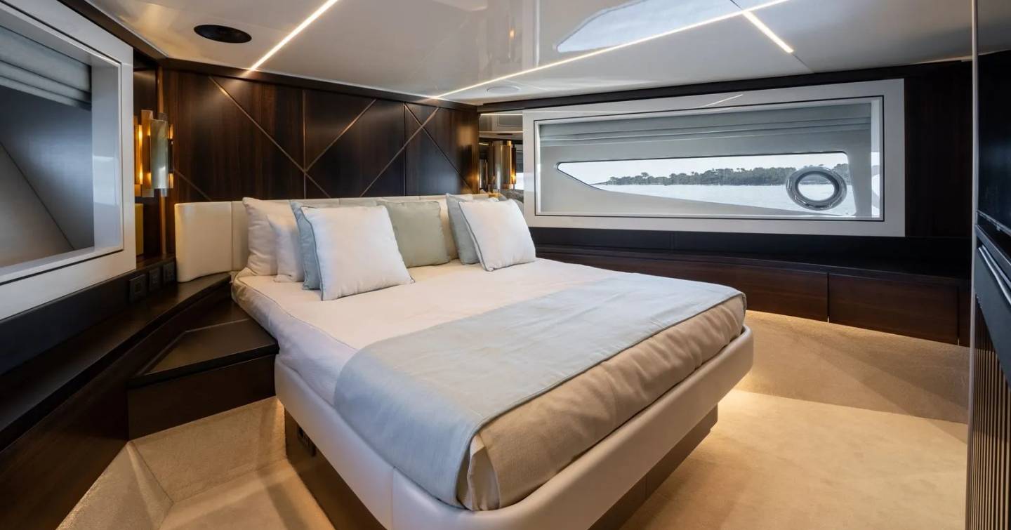 Motor Yacht Triple Eight guest cabin with double bed and large hull window