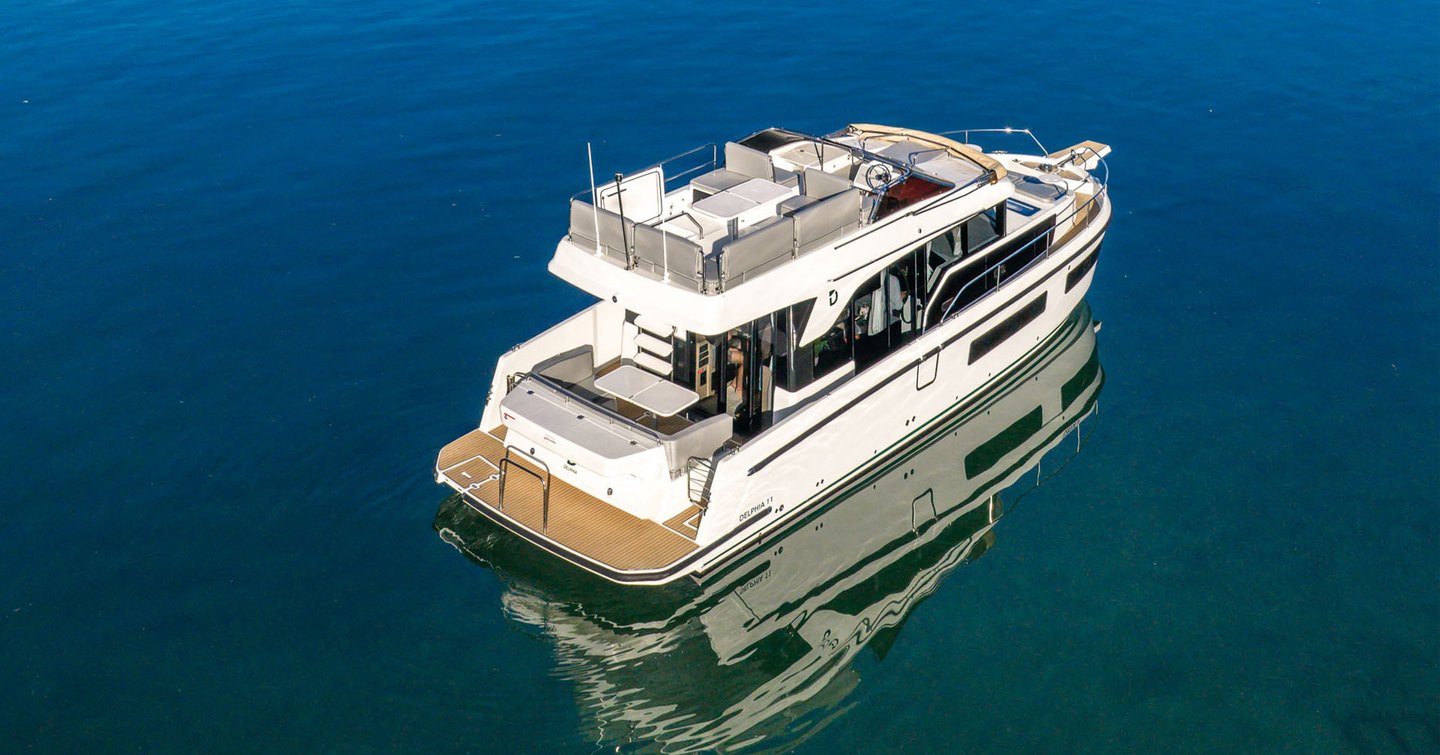 Updated Delphia 11 Flylounge Motor Yacht at anchor 