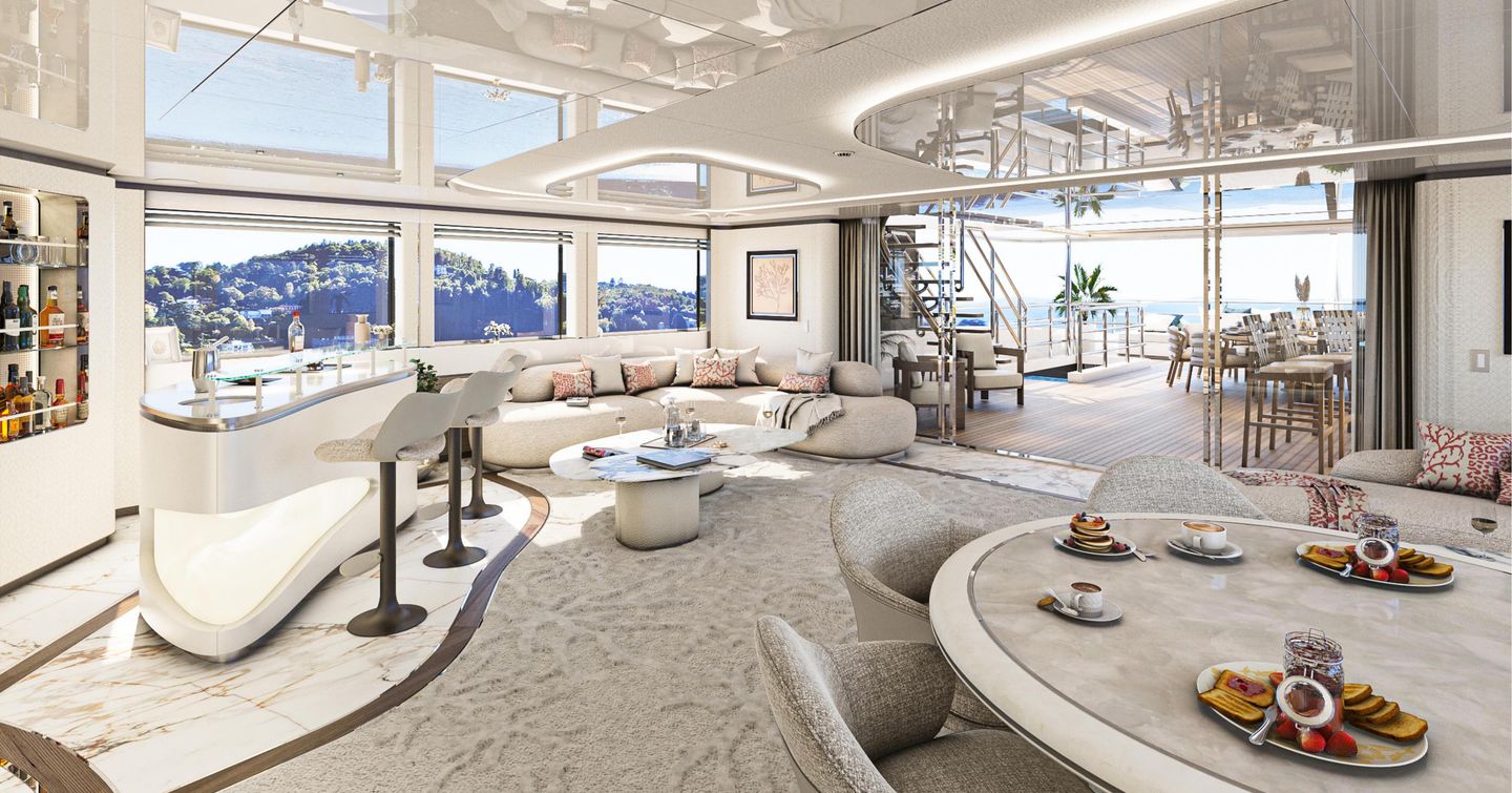 Superyacht Camilla saloon with curved white seating, bar area and circular dining table 