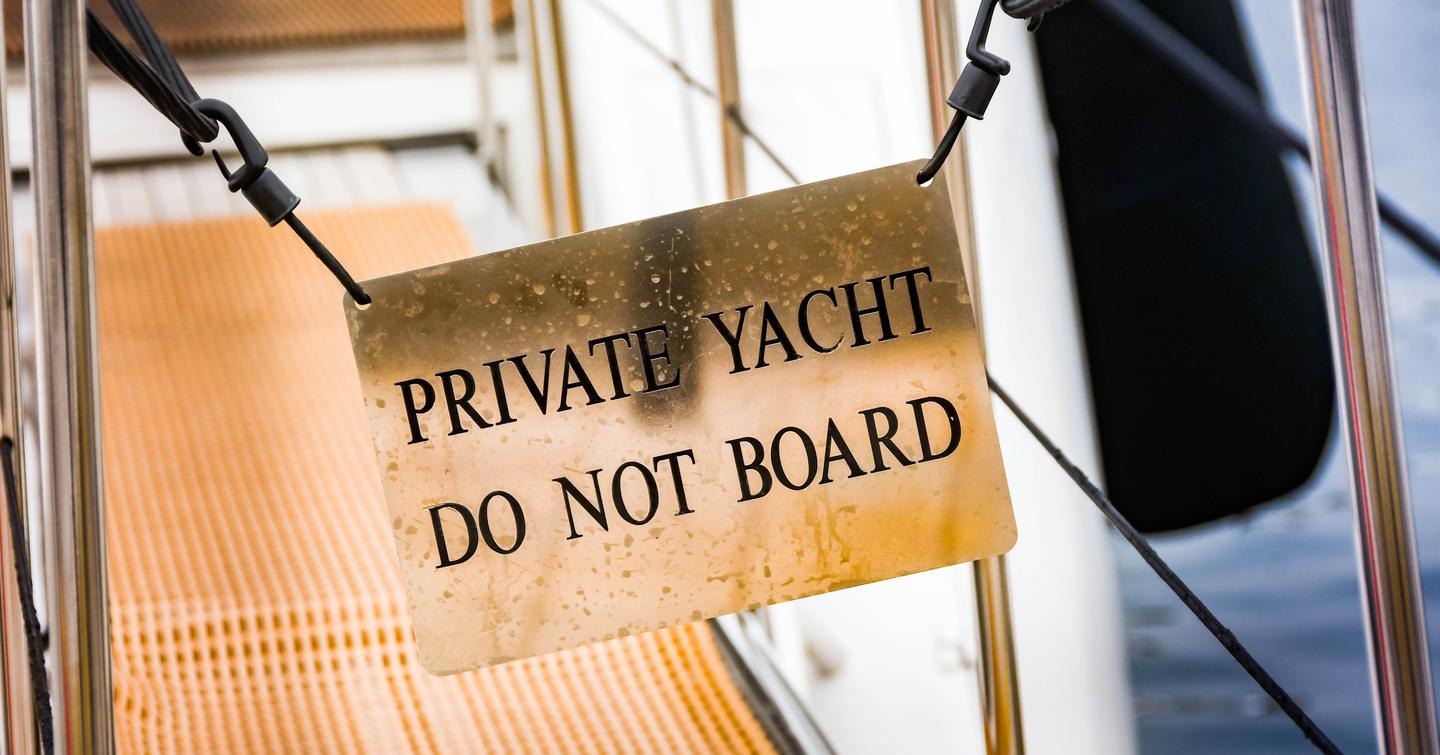 "Do not board" notice on the gangway of a luxury private yacht in Cannes harbour