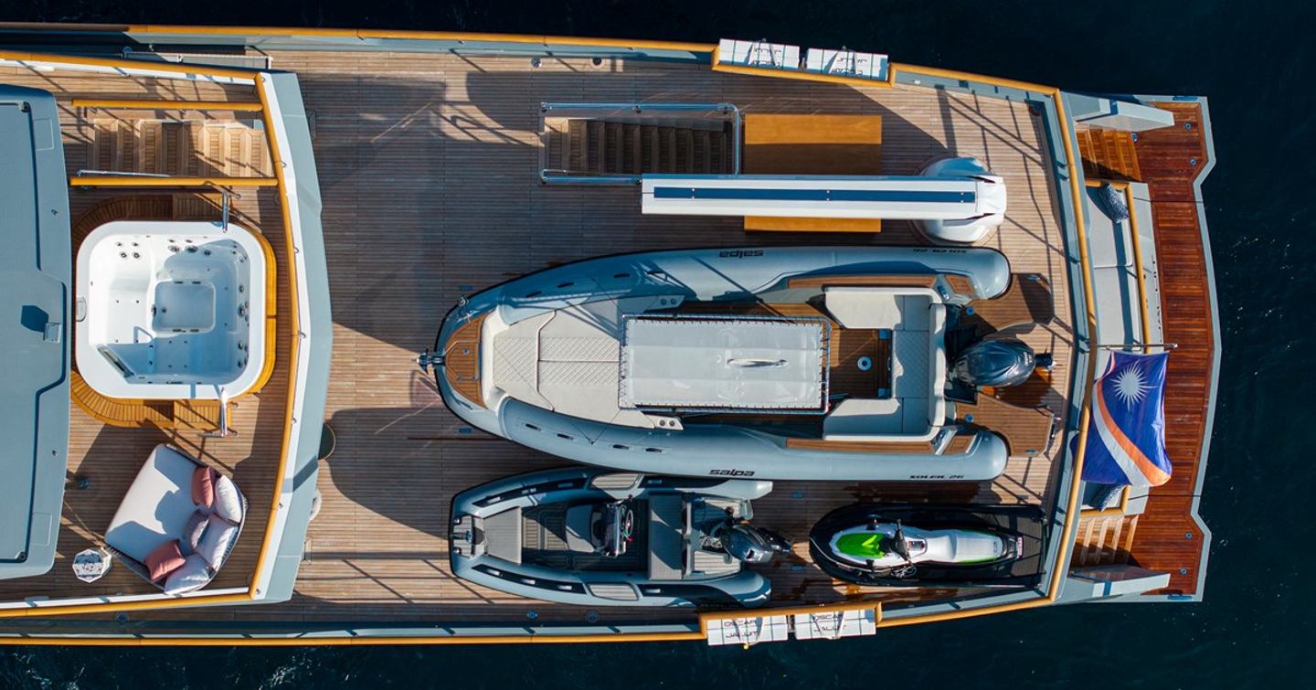 Aerial view of Superyacht Oscar's aft deck with tender on board 