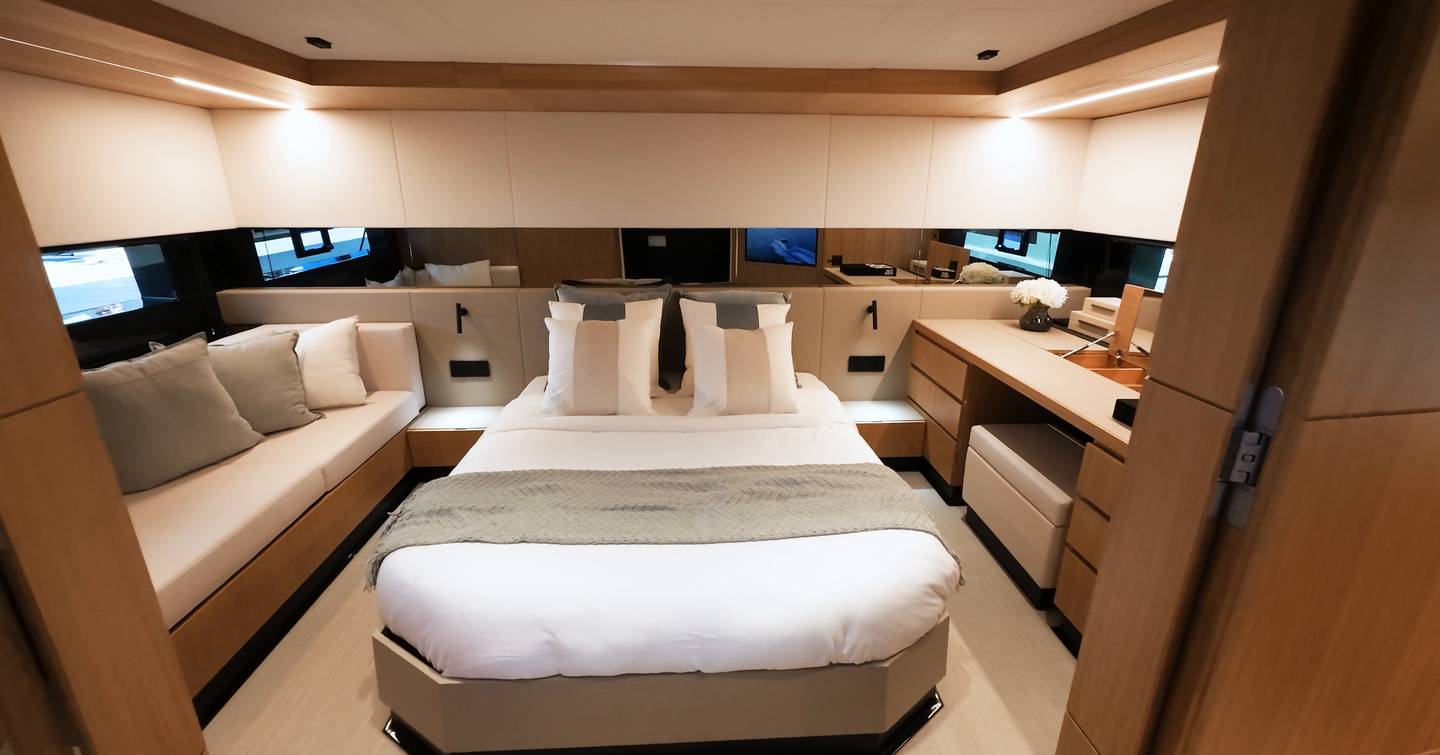De Antonio D60 owner’s cabin showing wall-mounted TV and dressing table