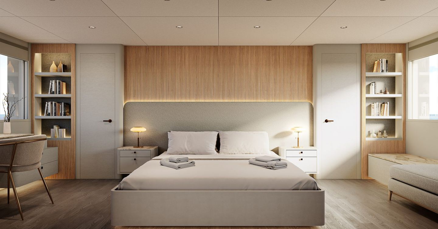 Owners cabin with king sized bed and desk area on motor yacht 27XP