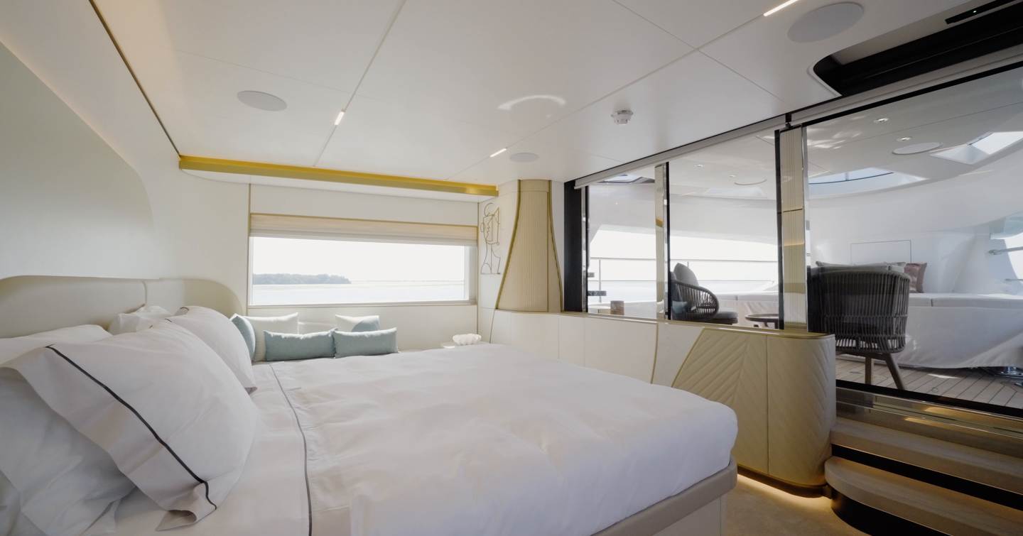 Owner's suite aboard the Gulf Craft Majesty 100 Terrace opening onto the private terrace
